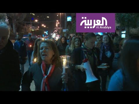 شاهد مسيرة بالشموع وسط بيروت لنبذ الطائفية